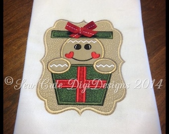 Adorable Gingerbread in a elegant border peeking out of a Christmas present applique design