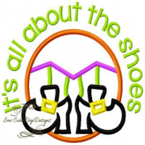 May include: It's all about the shoes embroidery design with a circle of orange thread, a pair of black shoes with gold buckles, and green and purple thread accents.