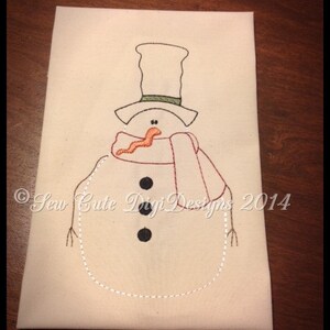 May include: Embroidered design of a snowman with a black top hat, red scarf, and black buttons. The design is on a white fabric background. The text "Sew Cute Digi Designs 2014" is in the bottom left corner.