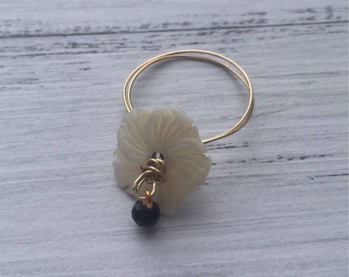Gold filled wire ring with mother of pearl flower and mobile spinel bead