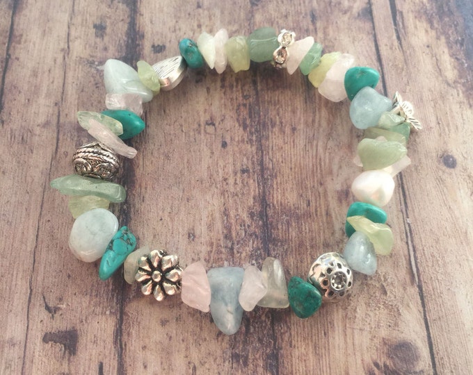 Bracelet with various beads of semi-precious stones and silver plated elements