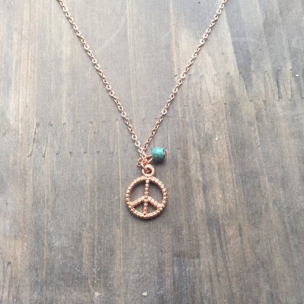 Rose gold plated necklace with peace sign and turquoise bead