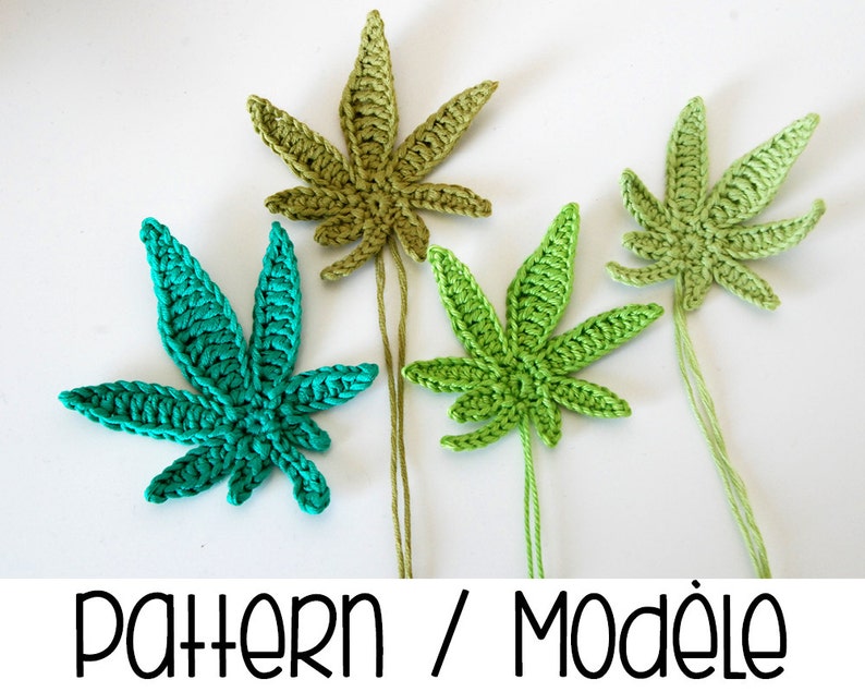 May include: Three crocheted marijuana leaf ornaments in green, light green, and teal.