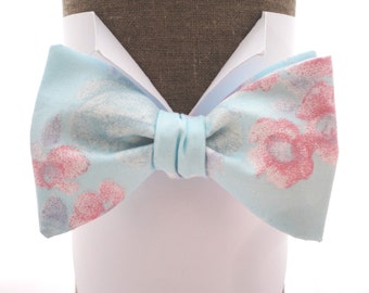 Self tie or pre tied bow tie in pale aqua blue with pink roses, also available in pre tied, will fit up to 20" (50cms) neck size.
