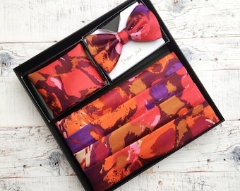 Reds, Pinks, Oranges and Purples Feature in this Cummerbund Set.  Pleated, Interlined and Lined. Adjustable to Fit Most Waist Sizes.