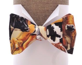 Cow print bow tie in 100% cotton, self tie or pre tied bow tie, one size with adjustable neck band.