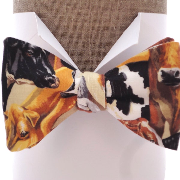 Cow print bow tie in 100% cotton, self tie or pre tied bow tie, one size with adjustable neck band.
