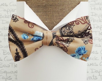 Bow ties for men, black paisley and blue roses on a coffee background