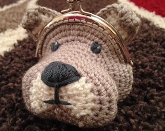 May include: A crocheted gray and white dog-shaped coin purse with a silver metal frame.