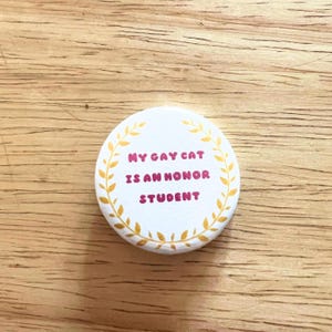 My gay cat is an honor student pin back button meme