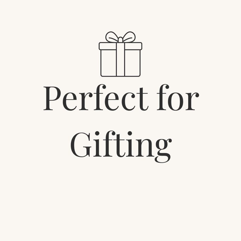 May include: A graphic illustration featuring a black line drawing of a square gift box with a bow on top, positioned above the black text "Perfect for Gifting" centered on a light cream-colored background.