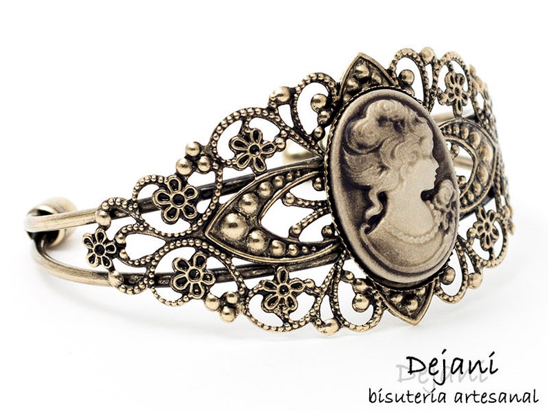 brown lady brooch