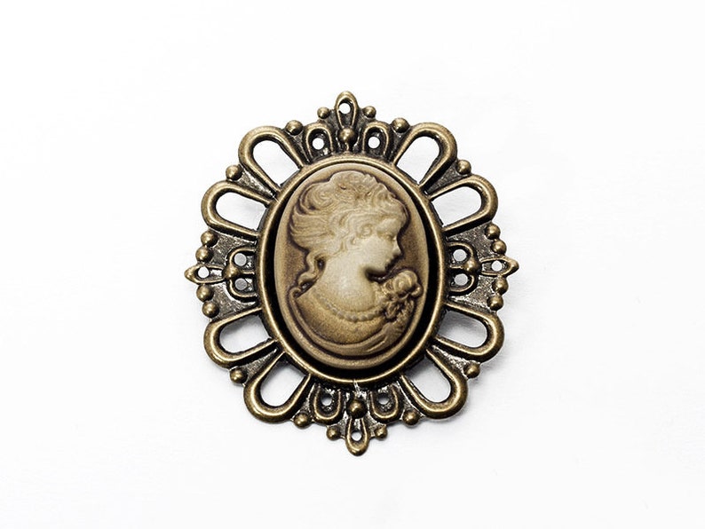 brown lady brooch