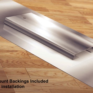 Może przedstawiać: Srebrna metalowa rama z białym tłem. Rama jest zaprojektowana tak, aby obraz unosił się na ścianie. Tekst "Float Mount Backings Included for easy installation" jest widoczny u dołu obrazu.