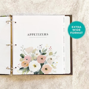 May include: Open binder with a floral design and the word "APPETIZERS" in black text. The design includes a bouquet of pink, peach, and white flowers with green leaves. The binder has gold rings and a brown spine. The words "EXTRA WIDE FORMAT" are in a teal circle.
