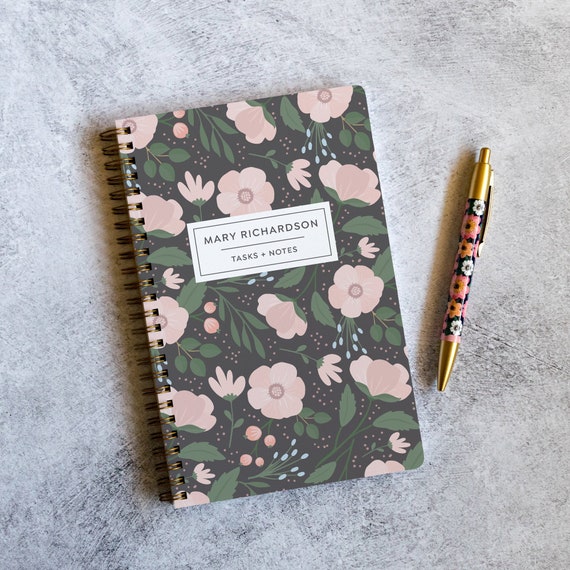 Custom notebooks or planners with their name