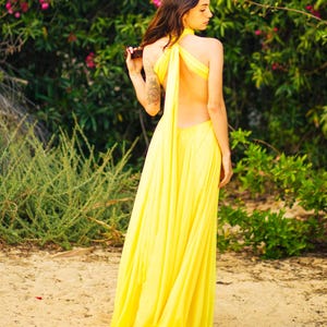 Open back long evening halter neck gown with long tie