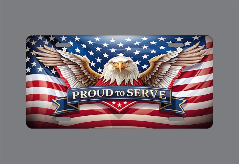 May include: A rectangular license plate featuring a graphic of a bald eagle with wings spread wide against a backdrop of the American flag. A blue banner across the center displays the text PROUD TO SERVE in white capital letters.