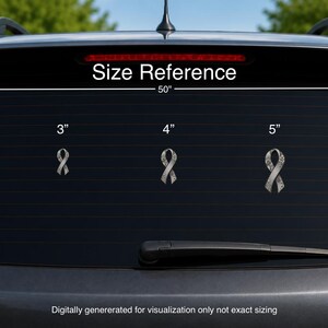 May include: Five grey awareness ribbon decals with a floral pattern displayed on a car window. The text Size Reference is visible above the ribbons, with labels 2, 3, 4, 5, and 6 inches indicating the height of each individual ribbon decal.