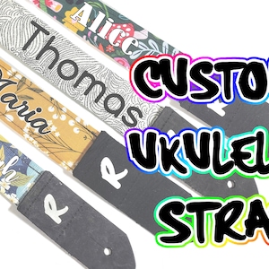 May include: Four ukulele straps with different floral patterns and personalized names: Sarah, Maria, Thomas, and Alice. The straps are black with white stitching and have a custom ukulele strap label.
