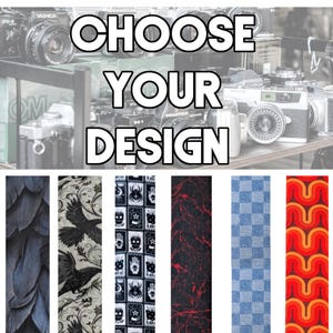May include: A collection of six vertical fabric strips featuring distinct patterns including dark feathers, black crows, occult symbols, red paint splatters on black, blue checkered squares, and orange wavy lines, with the text CHOOSE YOUR DESIGN.