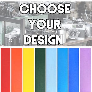 May include: Image featuring the text "CHOOSE YOUR DESIGN" above a series of colorful fabric swatches. The swatches include shades of red, orange, yellow, green, blue, and purple. A collection of vintage cameras is in the background.