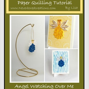 May include: A paper quilling tutorial for making an angel ornament. The tutorial includes three images showing different stages of the project. The first image shows a finished angel ornament on a gold stand. The second image shows a close-up of the angel's head and wings. The third image shows the angel's body and wings. The tutorial is titled "Angel Watching Over Me" and is by Lisa. The website address is www.Neverboredcreations.com.