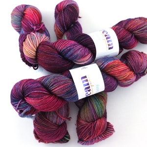 Dream in Color Classy in color Cabaret 901, worsted weight superwash wool knitting yarn, magenta, burgundy, rainbow hues