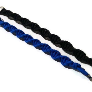 May include: Two braided keychains, one blue and one black, with silver key rings.