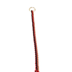 May include: A black and red braided lanyard with a silver ring at the top.