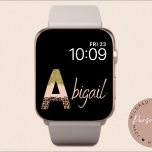 May include: A black and white Apple Watch face with a gold glitter and leopard print letter "A" and the name "Abigail" written in cursive. The time is 10:09 and the date is FRI 23. A pink circle with the text "Personalise Made With Love" is in the lower right corner.