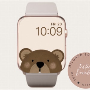May include: A digital watch face with a brown bear peeking out from the bottom of the screen. The time is 10:09 and the date is FRI 23. The watch face is surrounded by a pink circle with the text "Mildred's Digi Art Made With Love" and "Instant Download".