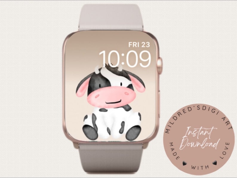 以下が含まれることがあります： ピンクとゴールドのApple Watchの文字盤に、白黒の漫画の牛のイラストが描かれています。時間は10:09で、日付はFRI 23です。文字盤は、ピンクの円の中に「Mildred's Digi Art Made With Love」と「Instant Download」の文字が書かれています。