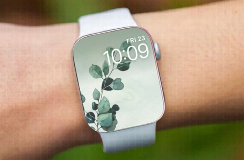 May include: A white Apple Watch with a white band, displaying a green leafy branch design and the time 10:09, with the date FRI 23.