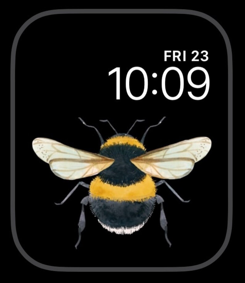 Peut inclure: Un bourdon noir et jaune aux ailes transparentes est centr&eacute; sur un fond noir. Il est 10h09, nous sommes vendredi 23.