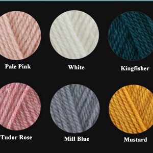 May include: Six balls of yarn in a range of colours, each presented in a circular shape against a black backdrop. The colours are pale pink, white, teal, Tudor rose, grey-blue, and mustard yellow. Each colour is labelled with its name.