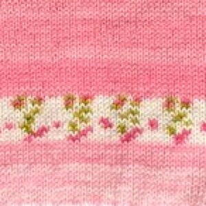 May include: A knitted fabric featuring a solid pink section and a horizontal band of white yarn decorated with a repeating pattern of small pink and green floral motifs. The texture shows consistent knit stitches throughout the entire surface.