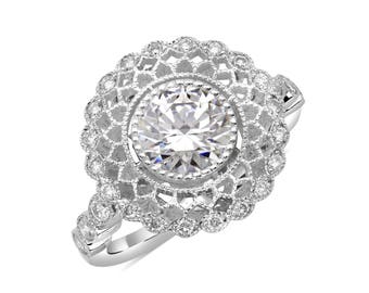 This elegant ring is set on a 14K white gold with 1.5 ct center Stone and accented by small diamonds.