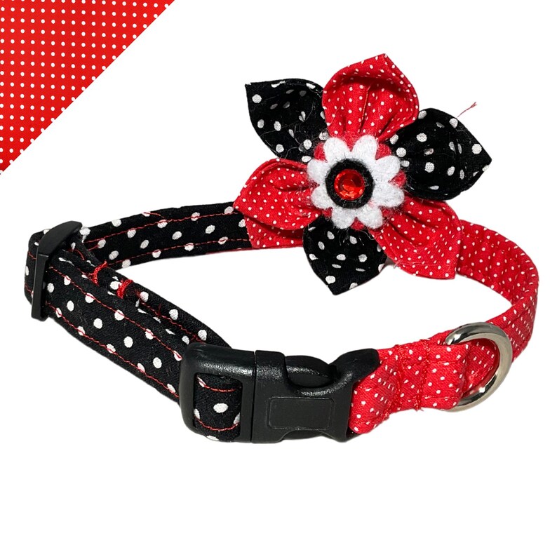 a polka dot dog collar with a flower on it