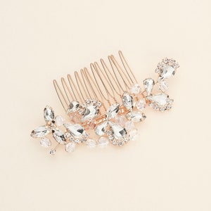 a hair comb with a bunch of crystal stones on it