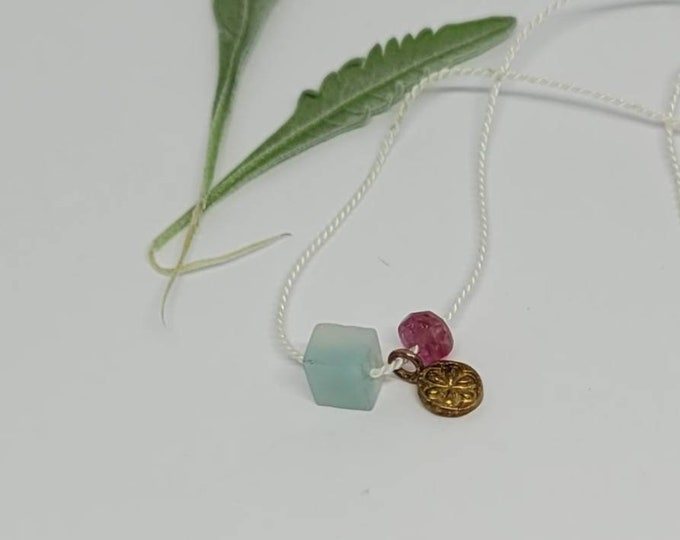 Cord necklace with gold vermeil daisy charm