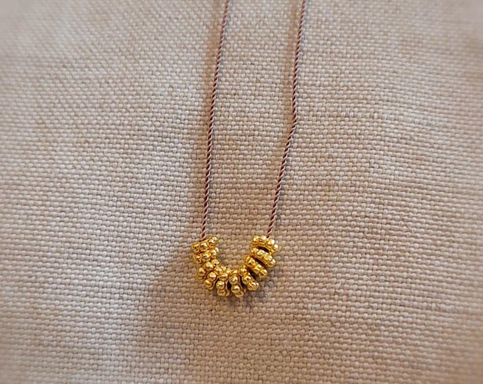 Gold beaded necklace- wheels of fortune-cord necklace-gift for her