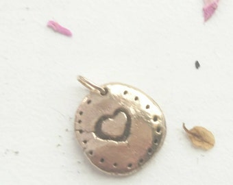 Handmade bronze charm with heart detail