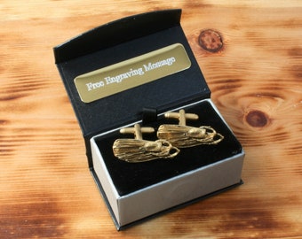 May include: Gold cufflinks in a black and silver gift box. The box has a gold plaque that says "Free Engraving Message".
