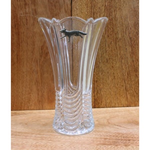 May include: A clear glass vase with a textured design and a silver fox figurine attached to the side.