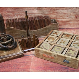 May include: A wooden game set with three different games: ring toss, a wooden bowling set, and a tic-tac-toe game. The games are all made of natural wood and have a rustic look.