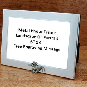 May include: A silver metal photo frame with a white mount and a clear glass front. The frame is 6 inches by 4 inches and can be used for landscape or portrait photos. The frame has a free engraving message option. A small pewter horse figurine is attached to the bottom of the frame.