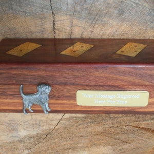 May include: A wooden box with a brass plaque that says "Your Message Engraved Here For Free". The box has three inlaid dominoes on the top and a pewter dog figurine on the front.