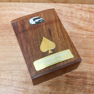 May include: A wooden card box with a gold spade design and a small metal van on the top. The box has a gold plaque with the text "Your Message Engraved Here For Free".