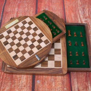 May include: A wooden chess set with a circular board and a separate compartment for the pieces. The board is made of light and dark wood, and the pieces are made of brown wood. The set is closed and ready to be played.